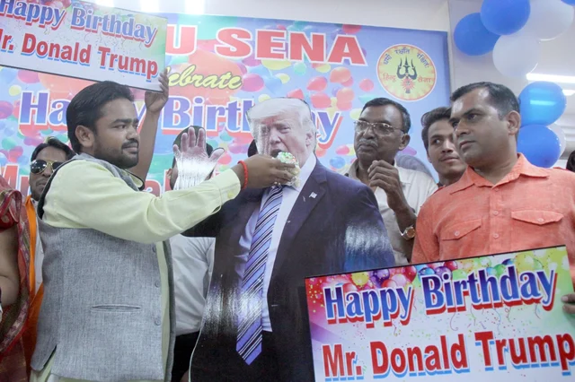 Hindu Sena activists celebrate the birthday of US President Donald Trump, in New Delhi. Hindu Sena activists celebrate the birthday of US President Donald Trump, in New Delhi.