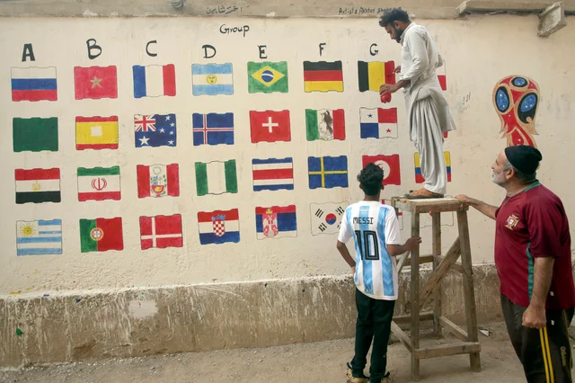 Pakistani football fans paint flags of participating countries in the upcoming FIFA 2018 World Cup, in suburbs of Karachi, Pakistan. Pakistani football fans paint flags of participating countries in the upcoming FIFA 2018 World Cup, in suburbs of Karachi, Pakistan.