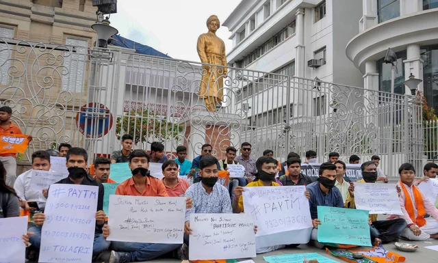 Members of Bharatiya Janata Yuva Morcha (BJYM) stage a silent protest infront of Swami Vivekananda’s ancestral house against the state government over the alleged cases of corruption during college and university admissions, in Kolkata. Members of Bharatiya Janata Yuva Morcha (BJYM) stage a silent protest infront of Swami Vivekananda’s ancestral house against the state government over the alleged cases of corruption during college and university admissions, in Kolkata.