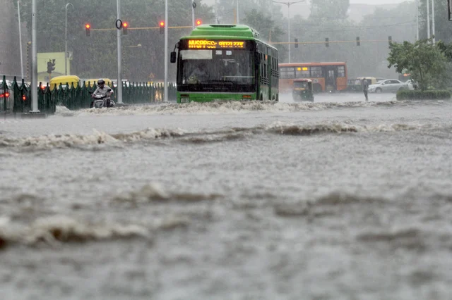 Traffic wades through water logged roads at ITO, due to heavy rain in New Delhi. Traffic wades through water logged roads at ITO, due to heavy rain in New Delhi.