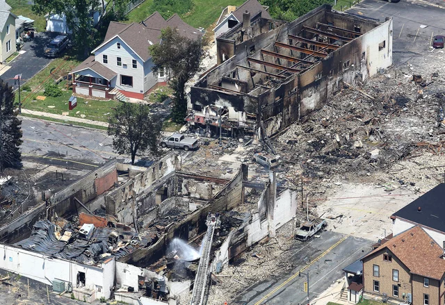 In a view looking northwest from above, the aftermath of a gas explosion in downtown Sun Prairie, Wis., is seen. At the top right of the image is the site of the former Barr House where the explosion originated and leveled the building. Sun Prairie Fire Department Capt. Cory Barr was killed Tuesday when a natural gas explosion leveled most of a city block, including the tavern Barr owned. In a view looking northwest from above, the aftermath of a gas explosion in downtown Sun Prairie, Wis., is seen. At the top right of the image is the site of the former Barr House where the explosion originated and leveled the building. Sun Prairie Fire Department Capt. Cory Barr was killed Tuesday when a natural gas explosion leveled most of a city block, including the tavern Barr owned.