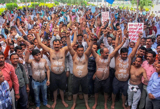 Madhya Pradesh Panchayat Sachiv Sanghthan activists stage a protest to press for the implementation of seventh pay scale and various other demands, in Bhopal. Madhya Pradesh Panchayat Sachiv Sanghthan activists stage a protest to press for the implementation of seventh pay scale and various other demands, in Bhopal.