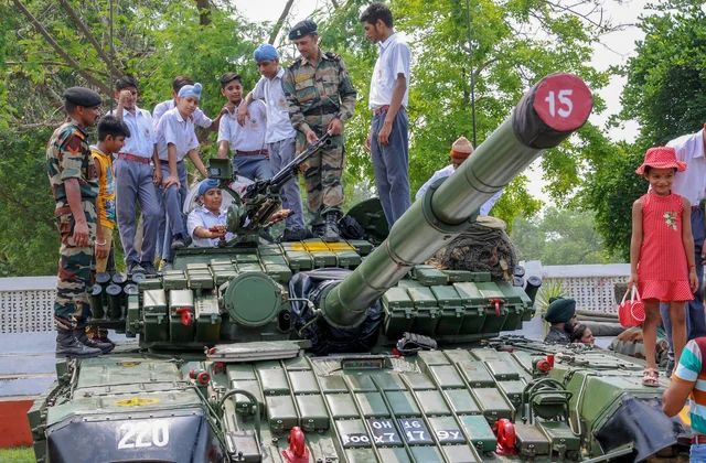 School students have a look of an army weapon during ‘Know Your Army’ exhibition at the Amritsar Cantonment area in Amritsar. School students have a look of an army weapon during ‘Know Your Army’ exhibition at the Amritsar Cantonment area in Amritsar.