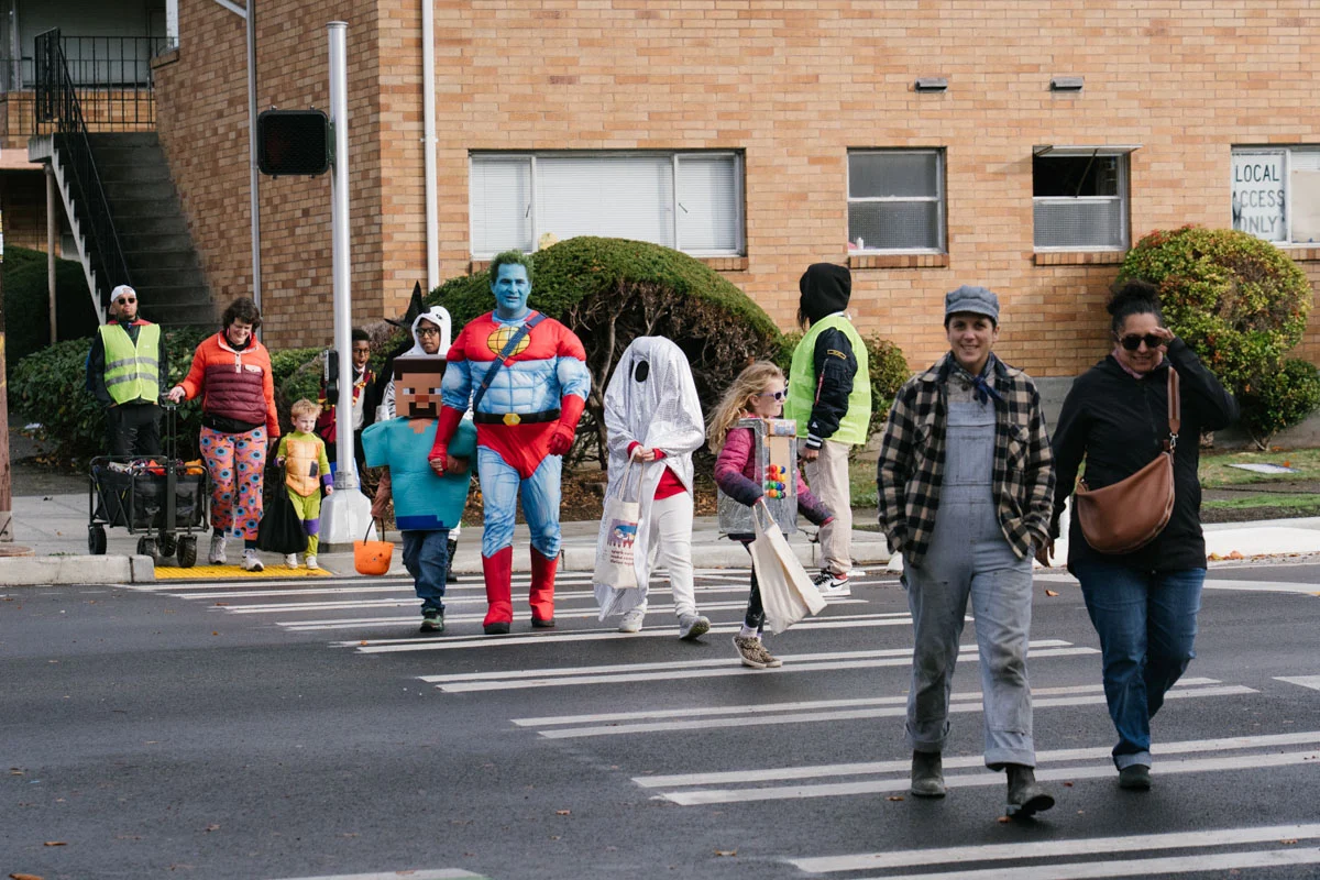 Children and families in costume celebrating during T'Challaween 2025 on Beacon Hill. Photo by Chloe Collyer, courtesy of the South Seattle Emerald.