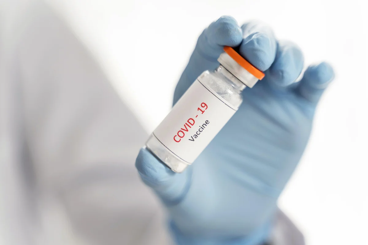Human Trial of COVID vaccine: Chennai Volunteer Claims Neuro Complications From Covid Test Vaccine, Serum Institute Says Symptoms Not Related To Vaccine Trials 3 swarajya%2F2020 12%2Fa85c420b 83d4 4cc2 830f 63ecd548d96f%2Fclose up doctor holding vaccine recipient her hand