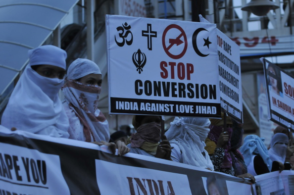 Women against love jihad hold placards to protest against the practice and conversion in Bhopal. (Mujeeb Faruqui/Hindustan Times via Getty Images)