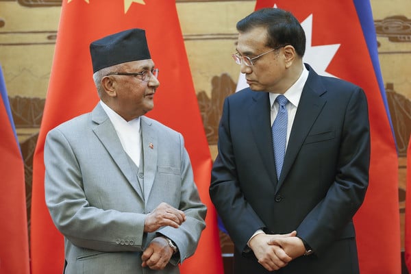 Chinese Premier Li Keqiang, right, talks to Nepal’s Prime Minister K P Sharma Oli.  