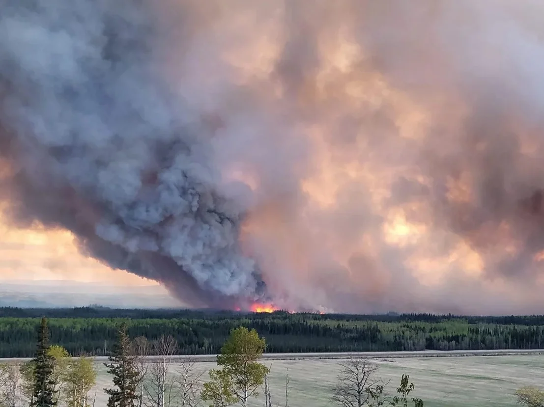 Thousands Evacuate as Wildfires Tear Through Western Canada