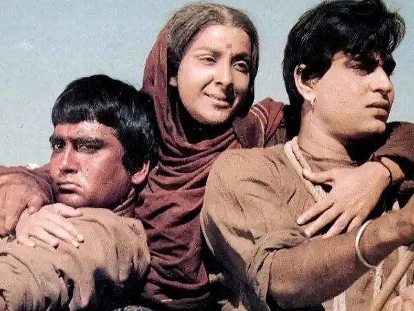 Sunil Dutt, Nargis Dutt and Rajendra Kumar is a scene from <i>Mother India</i> (1957)