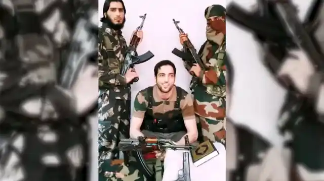 A still of Burhan Wani, 21-yr-old commander of the Hizb-Ul-Mujahideen with Saddam Padder on the left. (Photo Courtesy: ANI Screengrab)