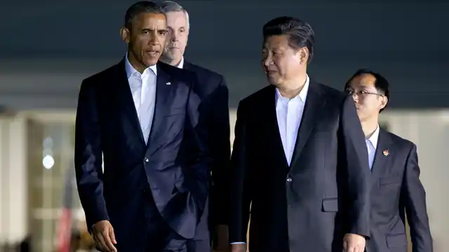 President Barack Obama and Chinese President Xi Jinping walk from the West Wing of the White House in Washington, Thursday, Sept. 24, 2015. (Photo: AP)