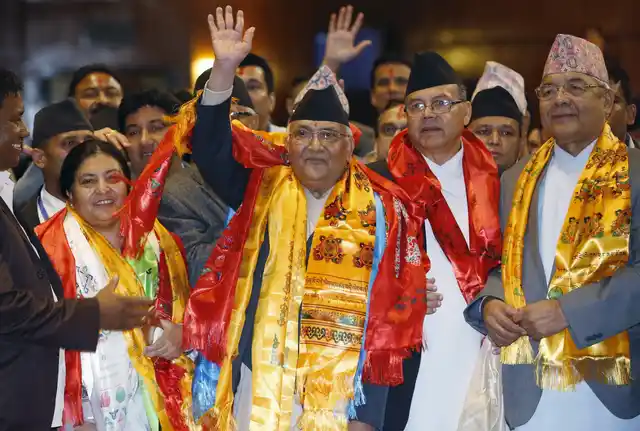 Nepal’s newly-elected prime minister, Khadga Prashad Sharma Oli, also known as KP Oli (C), waves after being elected as the country’s 38th prime minister.(Photo: Reuters)