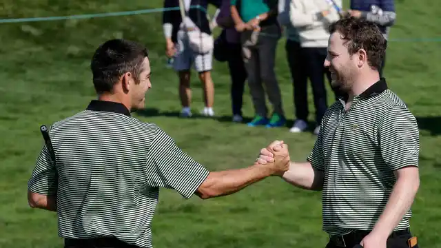 International team players Louis Oosthuizen and Branden Grace celebrate after defeating United States’ Matt Kuchar and Patrick Reed 3 & 2. (Photo: AP)
