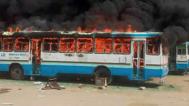 Kaithal : Jat community members torch a Haryana Roadways bus during their agitation for reservation. (Photo: PTI)