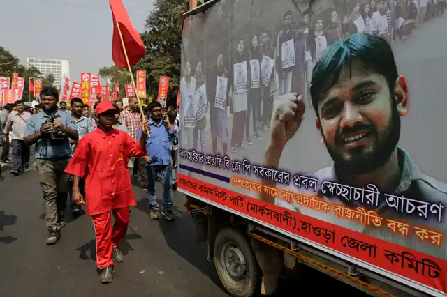 Supporters walk alongside a tableau of JNU Students’ Union President Kanhaiya Kumar. (Photo: AP)