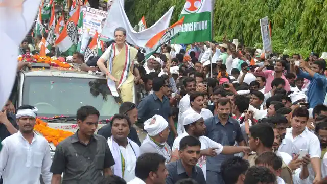 Congress President Sonia Gandhi during a roadshow in Varanasi on 2 August, 2016. (Photo: IANS)