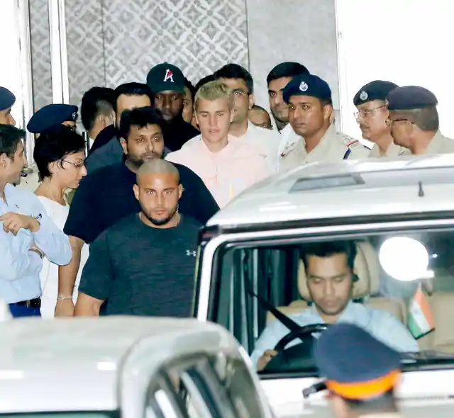 Justin Bieber arrives at Kalina airport with his team ahead of his concert tonight. (Photo: Yogen Shah)