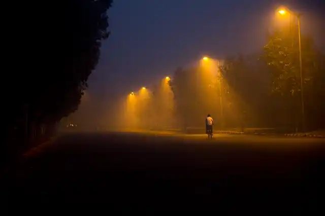 A cyclist pedals through the morning smog a day after Diwali festival, in New Delhi, India, Friday, Oct. 20, 2017.