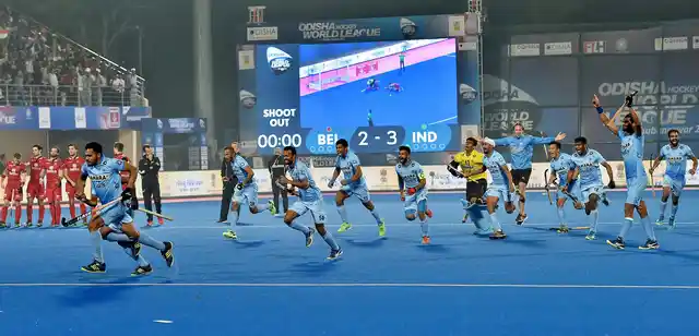 Indian team players celebrate after Akash Chikte stops the a Belgian penalty shot to win the quarter-final.