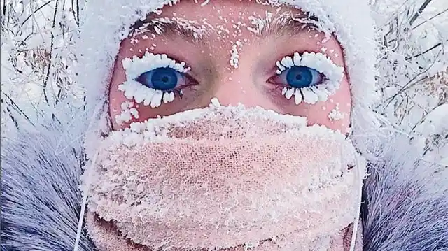 Woman clicks a selfie with her frozen eyelashes.