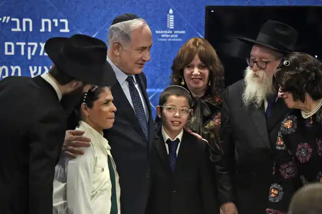 Israeli Prime Minister Benjamin Netanyahu with Mosche Holtzberg, his nanny and grand-parents after unveiling the Living Memorial in commemoration of the victims of the 26/11 attacks, at the Chabad House in Mumbai on Thursday.