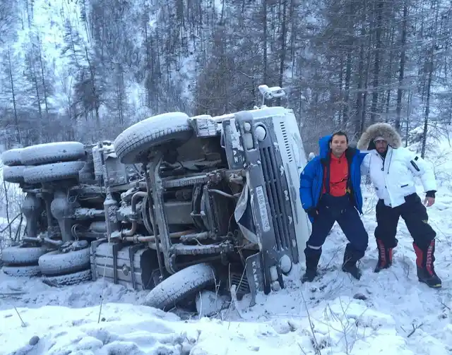 Car topples on the snow clad road of Oymyakon