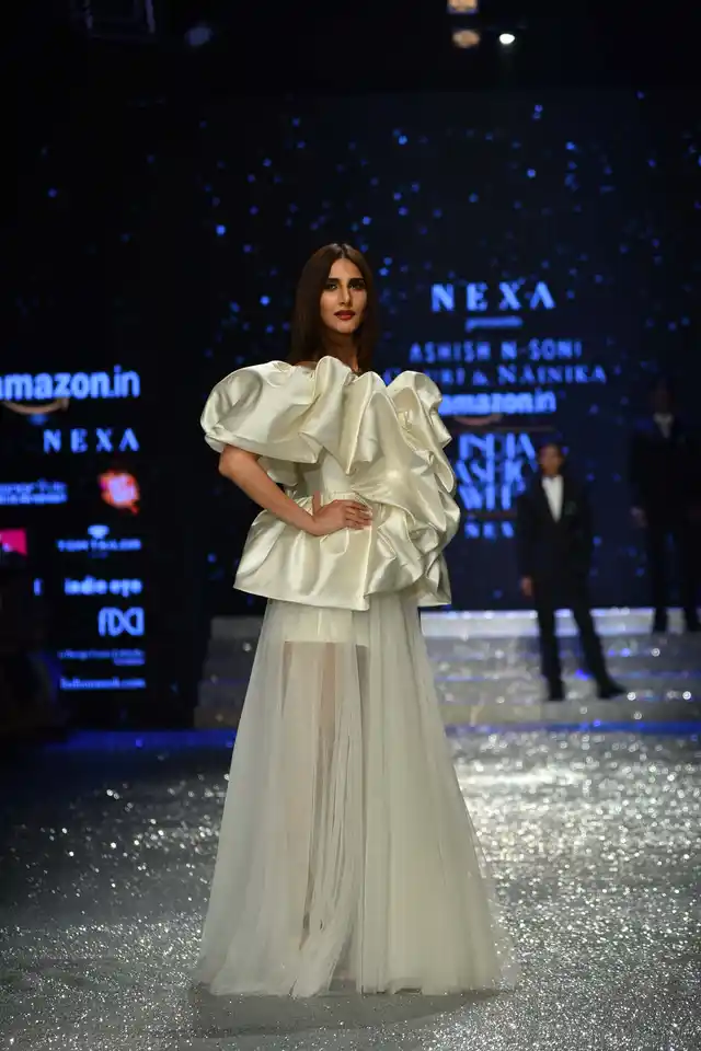 Vaani Kapoor looks like a vision in white as she dons a sheer outfit with ruffles designed by Gauri and Nainika.