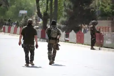 KABUL, April 30, 2018 (Xinhua) -- Afghan security forces members inspect at a blast site of Kabul, capital of Afghanistan, on April 30, 2018. At least 23 people, including two assailants, were killed and 27 others wounded after two suicide bomb blasts rocked a diplomatic district in central Kabul on Monday morning, officials said. (Xinhua/Rahmat Alizadah/IANS)