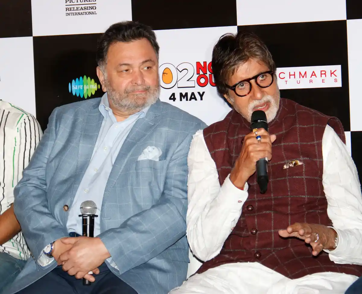 Big B addresses the media at the song launch as Rishi Kapoor looks on. 