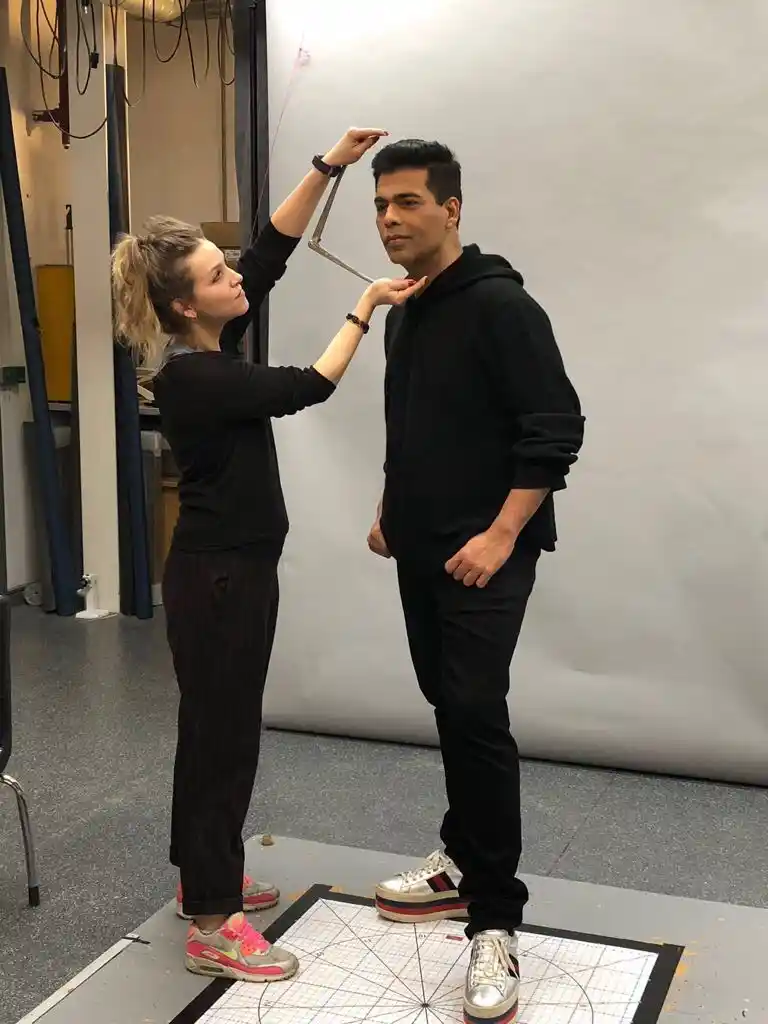 Karan Johar gets measured.