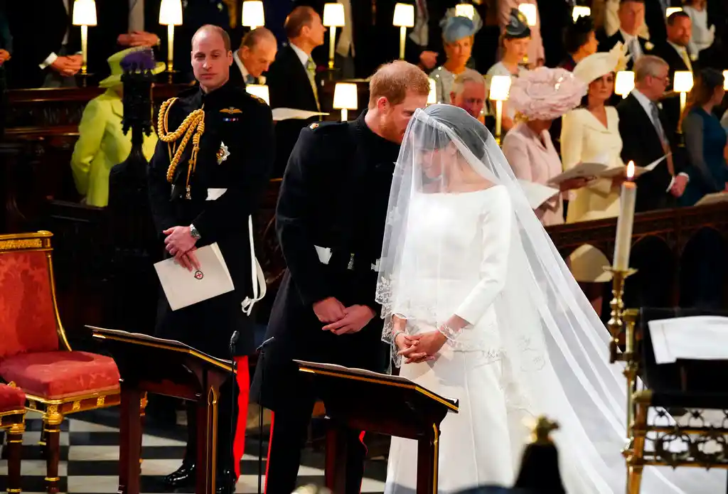 Britain’s Prince Harry speaks to his bride, Meghan Markle, during their wedding ceremony at St George’s Chapel in Windsor Castle in Windsor, near London, England, Saturday, 19 May, 2018.