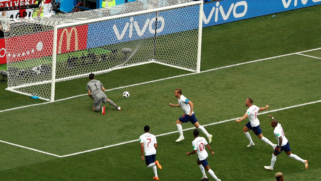 Englandâs Harry Kane (top right) celebrates with teammates after scoring past Panama goalkeeper Jaime Penedo (top left) his first penalty during their Group G match at the Nizhny Novgorod Stadium on Sunday.