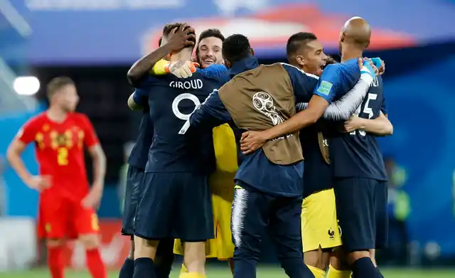 France national soccer team players celebrate after winning the semifinal match between France and Belgium at the 2018 soccer World Cup in the St. Petersburg Stadium, in St. Petersburg, Russia