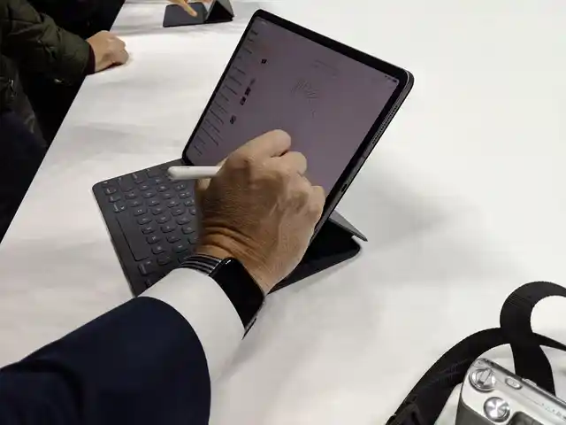 The second generation Apple Pencil attached magnetically to the iPad Pro. 