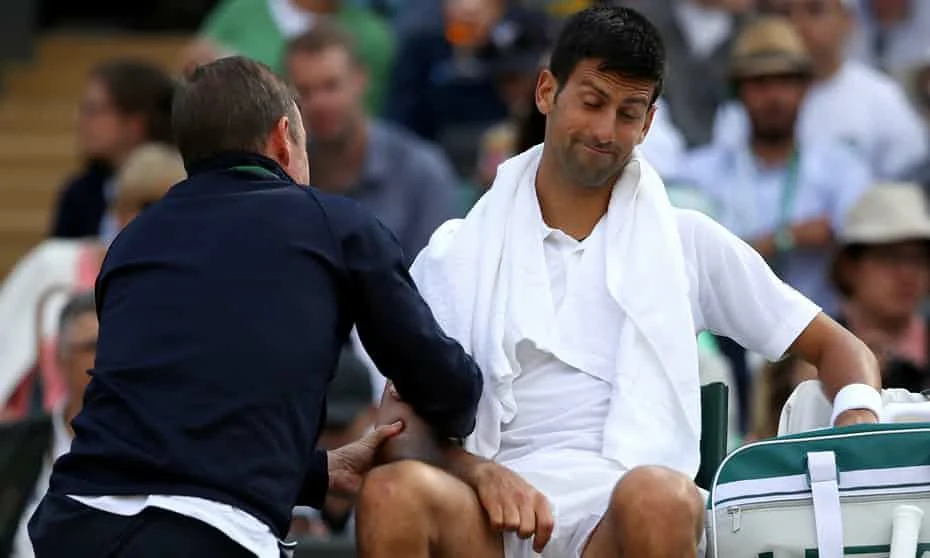 Novak Djokovic struggles with an elbow injury at Wimbldeon 2017