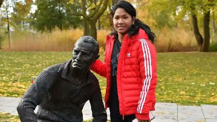 Swapna Barman seen here with the statue of Adolf Dassler, the founder of Adidas, when she visited the Athlete Services Lab in Herzogenaurach, Germany.