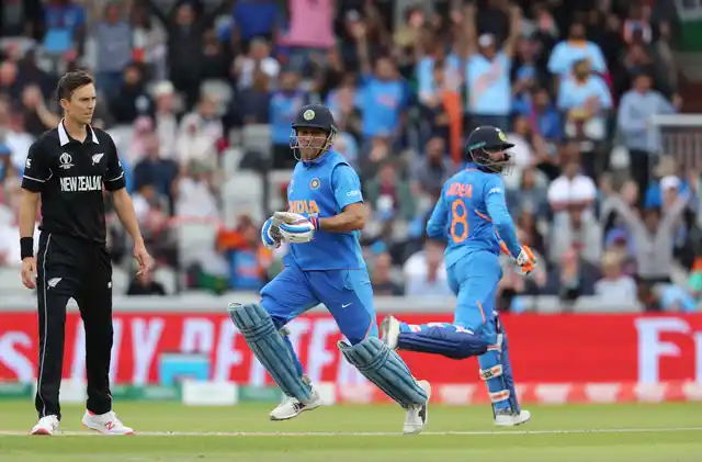 Ravindra Jadeja (R) and Mahendra Singh Dhoni during match between India and New Zealand at Old Trafford in Manchester.