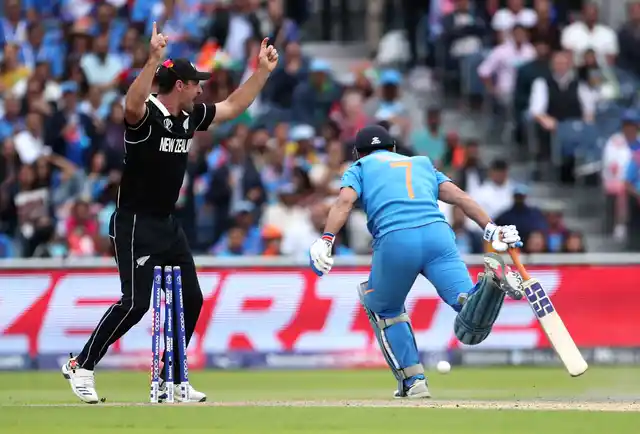 New Zealand’s Colin de Grandhomme celebrates the run-out of India’s MS Dhoni.