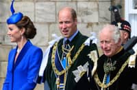 Britain’s King Charles III (R) stands with Britain’s Prince William, Prince of Wales and Britain’s Catherine, Princess of Wales to watch The British Royal Air Force’s (RAF) aerobatic team, the “Red Arrows”, perform a fly-past over the Palace of Holyroodhouse in Edinburgh on 5 July 2023, following a National Service of Thanksgiving and Dedication.
