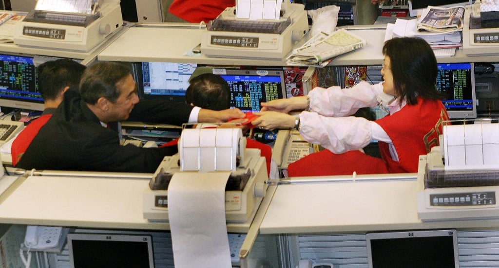 Holiday-hit Asian markets mixed; Wall St. record fails to inspire