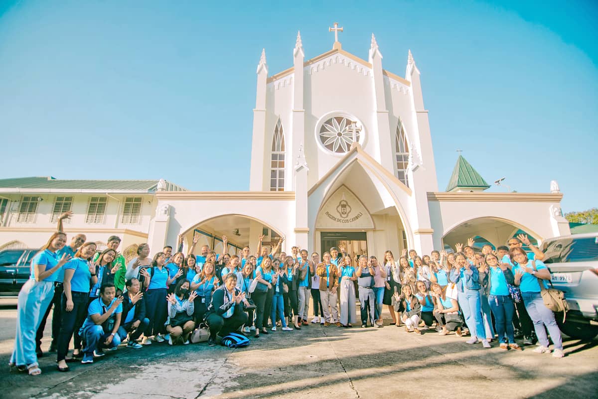 The top management of MORE Power, led by their President and CEO Roel Z. Castro along with their employees, posed outside the Carmelite Church after celebrating the mass commemorating the 5th anniversary since being granted a franchise to operate as a distribution utility in Iloilo City.