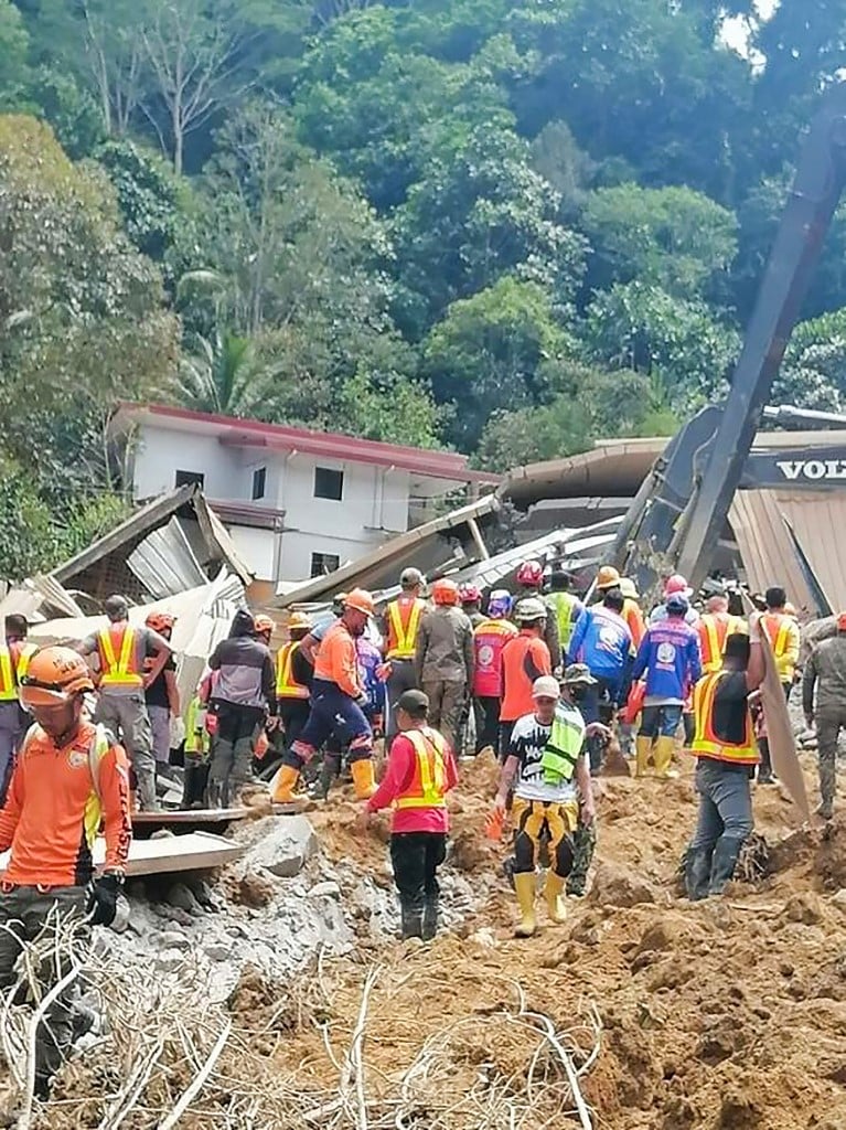 In this handout photo from the Eastern Mindanao Command, Armed Forces of the Philippines (AFP) taken on February 7, 2024 and received on February 8, 2024, shows responders conduct search and rescue operations in Maco, Davao de Oro.