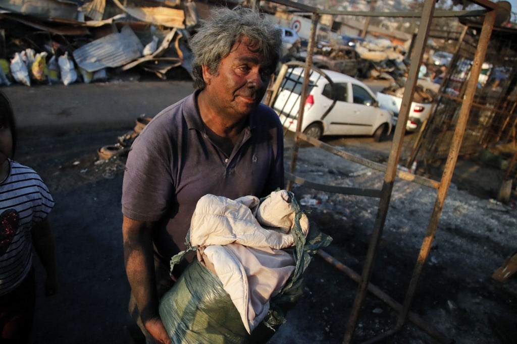 Chile mourns 122 killed in wildfire inferno, searches for missing