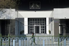 Australia expresses 'outrage' to China over writer's suspended death sentence