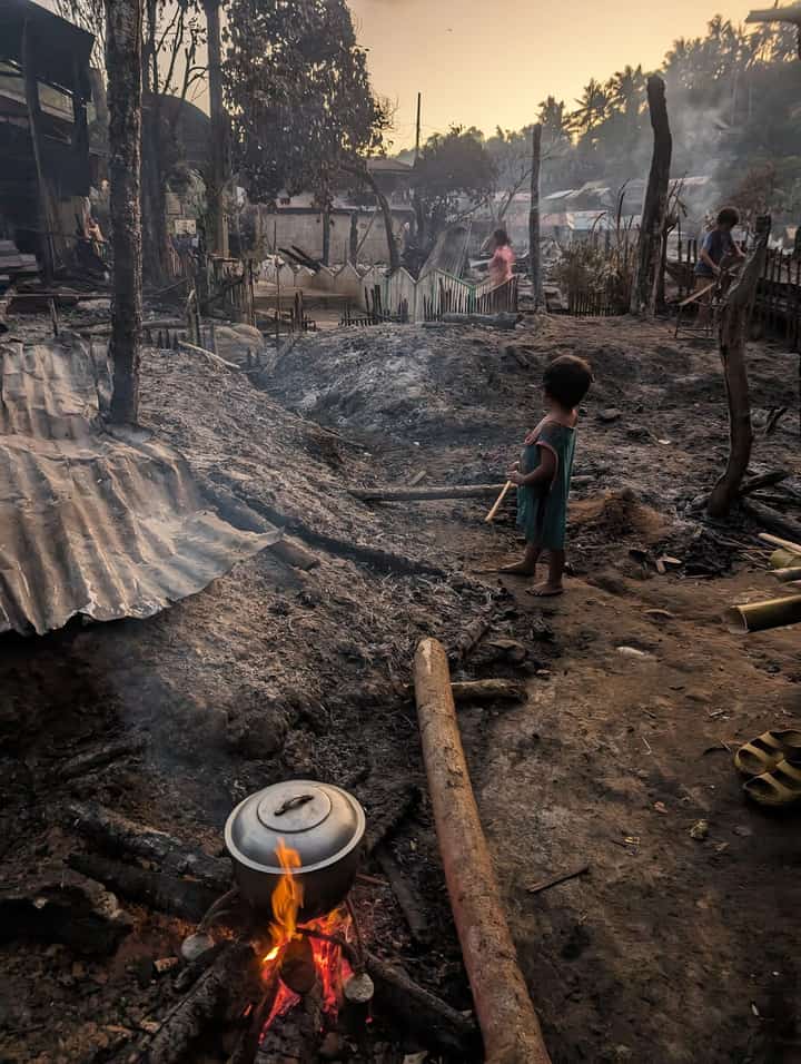 A child looks at what was left of their houses after a blaze engulfed almost an entire village in Calbayog City, Samar province last Monday. At least 82 houses were gutted by the fire, which accounts to half of the residences in Barangay Himalandrog.