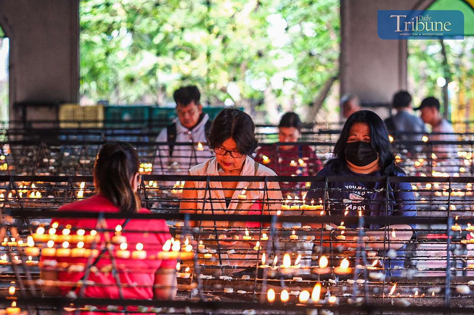 Catholics light candles