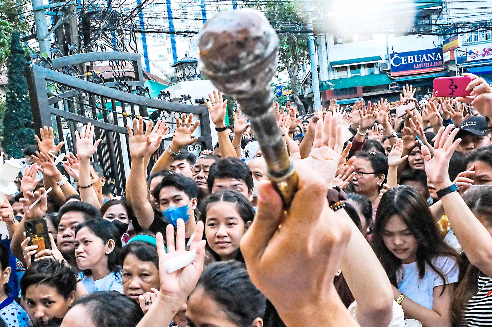 Churchgoers rush to enter the church to be blessed after the Salubong on Easter Sunday in Diocesan Sto. Niño Parish Church in Bago Bantay, Quezon City.