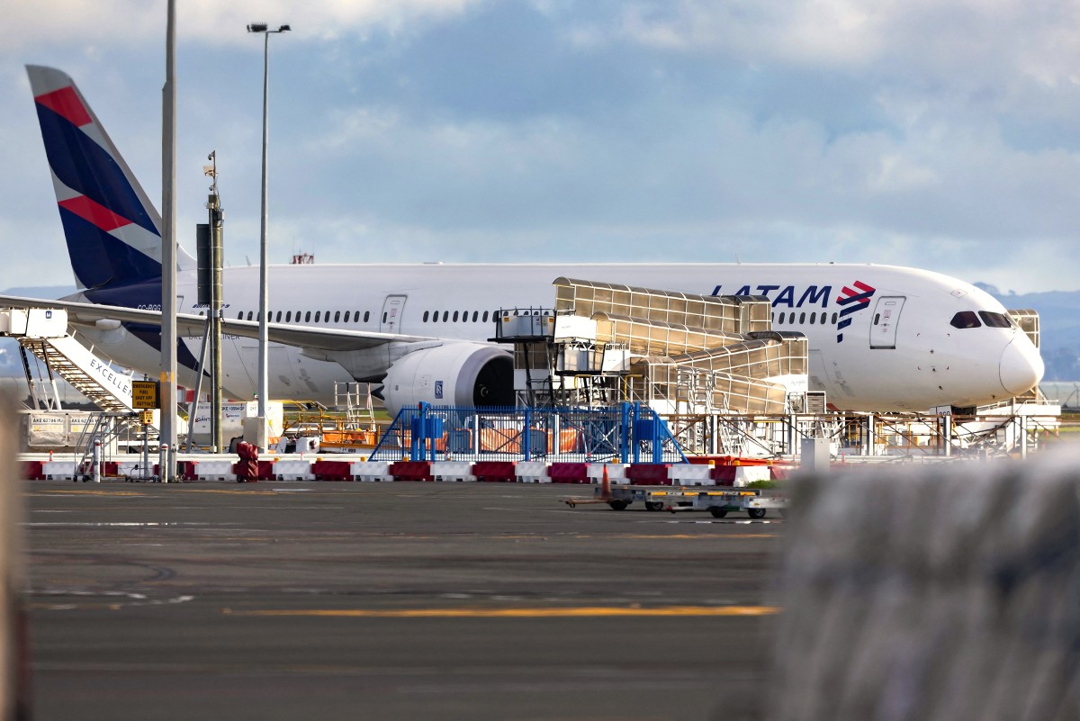 The LATAM Airlines Boeing 787 Dreamliner plane that suddenly lost altitude mid-flight a day earlier, dropping violently and injuring dozens of terrified travellers, is seen on the tarmac of the Auckland International Airport in Auckland on March 12, 2024.