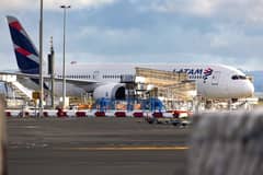 The LATAM Airlines Boeing 787 Dreamliner plane that suddenly lost altitude mid-flight a day earlier, dropping violently and injuring dozens of terrified travellers, is seen on the tarmac of the Auckland International Airport in Auckland on March 12, 2024.
