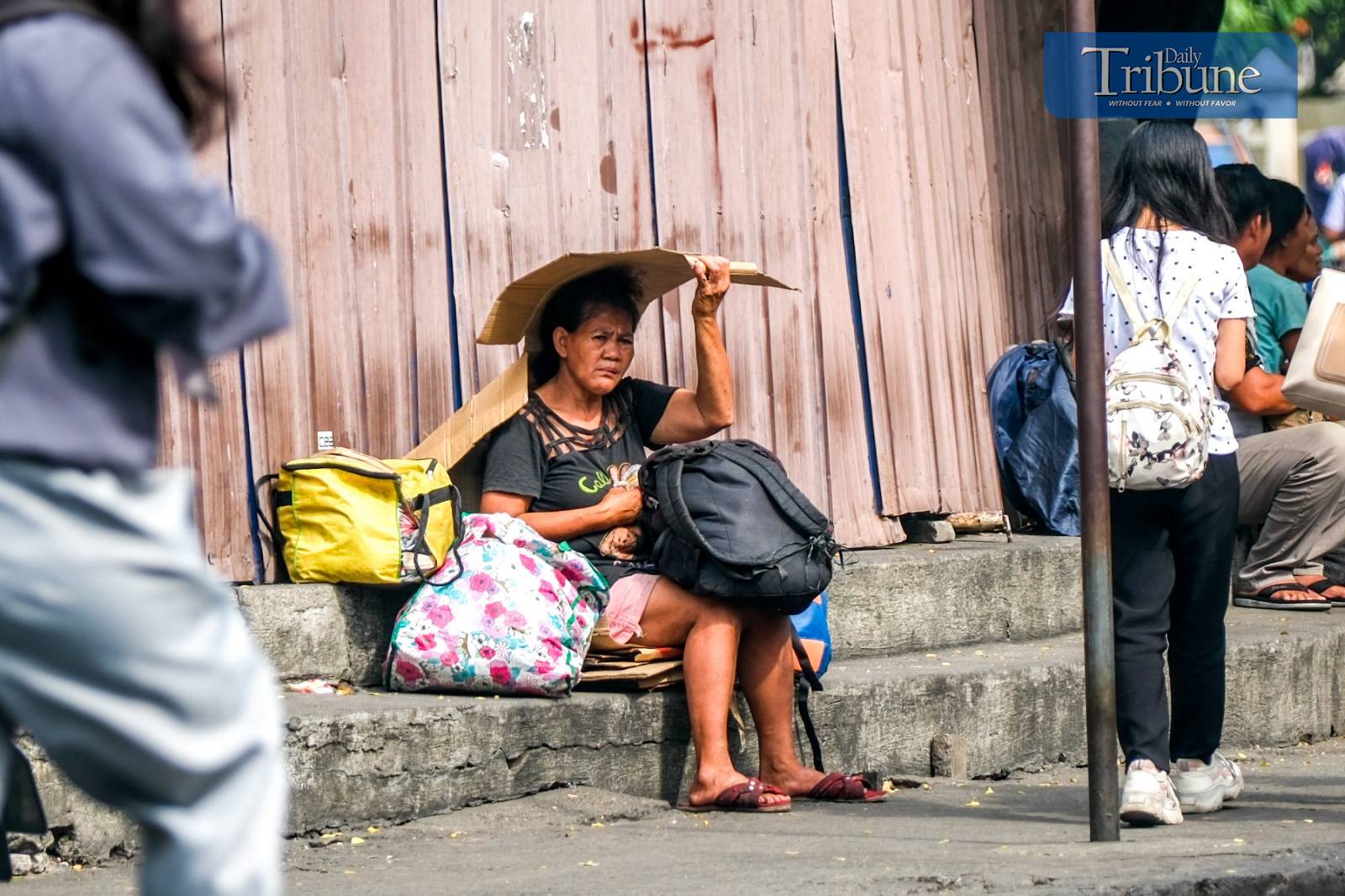 Woman protects herself from sun's scorching heat